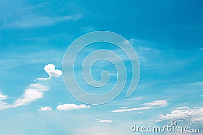Clouds Heart shaped patterns on bright blue sky background Stock Photo