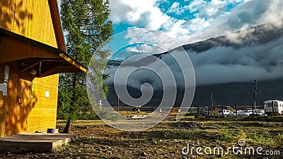 Clouds over a mountain valley Stock Photo