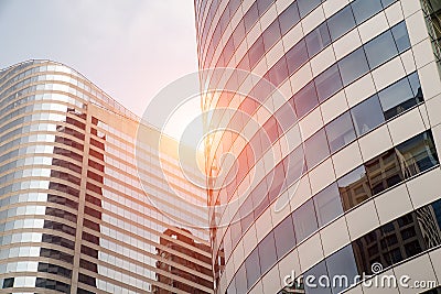 Clouds reflected in windows of modern business office building. Stock Photo