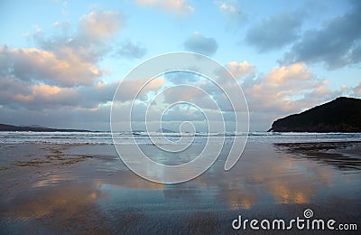 Clouds reflection in a wet sand Stock Photo