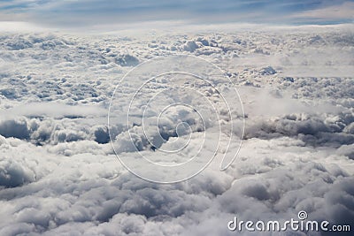 Clouds seen from an airplane, sunshine, soil background Stock Photo