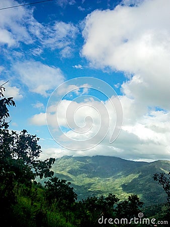 Clouds in the shape of a geenie Stock Photo