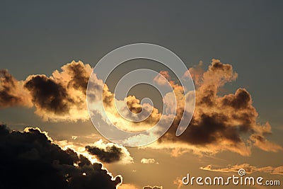 Clouds silver lining and sunset colors in sky Stock Photo