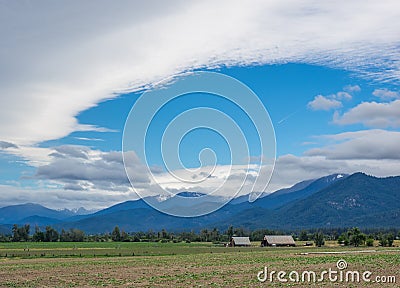 Clouds, sky, field and tree Stock Photo