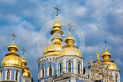 Clouds surround St Michaels in Kiev classic golden cupolas of th Stock Photo