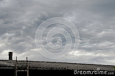 Cloudscape with dark Mammatus clouds Stock Photo