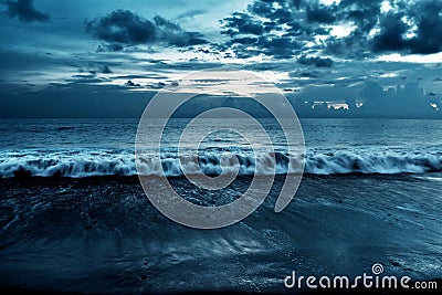 Cloudy beach background at night Stock Photo