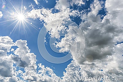 Cloudy Blue Sky as Background. Direct Sunlight, Sun Above the Clouds Stock Photo