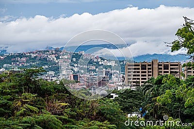 Cloudy Caracas city with the Avila at the background. Editorial Stock Photo