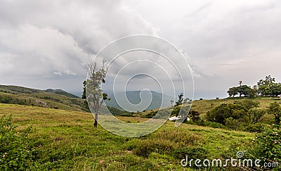 Cloudy evening on a hill Stock Photo