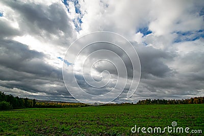 Cloudy meadow landscape Stock Photo