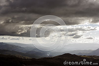 Cloudy mountains at sunset Stock Photo