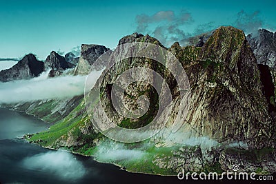 Cloudy mountaintops of fjords Stock Photo