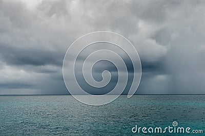 Cloudy rainy sky above great ocean Stock Photo