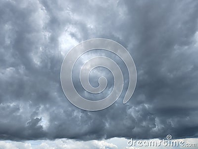 cloudy sky with black clouds forming a straight line Stock Photo