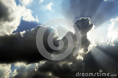 Cloudy sky with sunrays Stock Photo