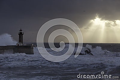 Cloudy sunset with sunbeams in the Oporto coast Stock Photo