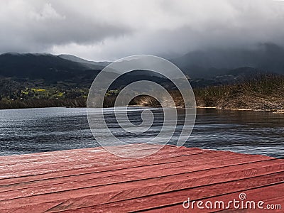 Cloudy view from a floating pier on a lake. Stock Photo