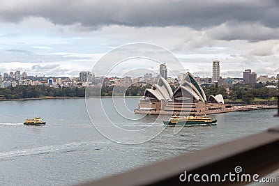 Ferry boats arriving to the Harbour of Sydney on a cloudy winter day Editorial Stock Photo