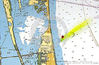 A Clouser Fly on a Nautical Chart Stock Photo