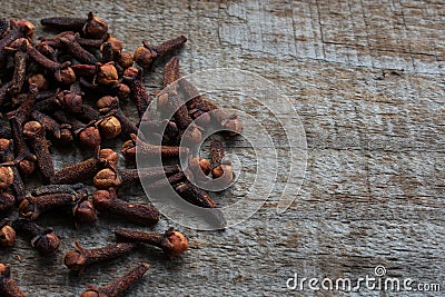 Cloves on wooden background Stock Photo