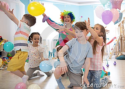 Clown at children birthday party entertaining kids Stock Photo