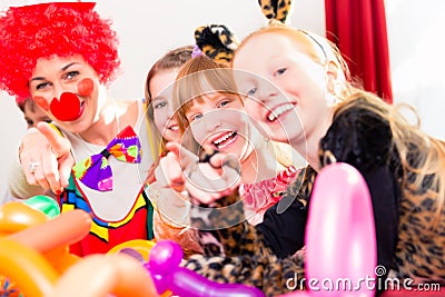 Clown at children birthday party with kids Stock Photo