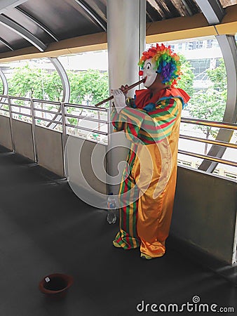 Clown playing flute Editorial Stock Photo