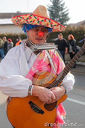 Clown playing a guittar Editorial Stock Photo