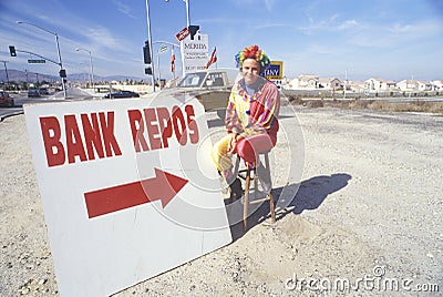 Clown salesperson with Bank Repo sign Editorial Stock Photo