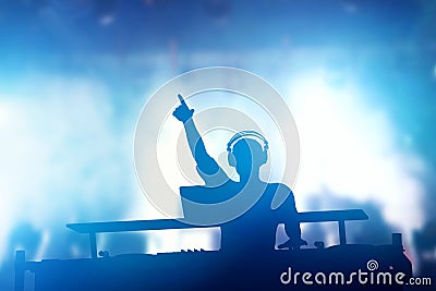 Club, disco DJ playing and mixing music for people. Nightlife Stock Photo