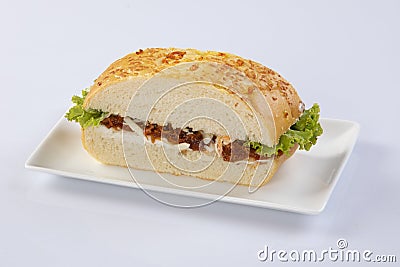 Club Sandwich with pomes salad And tomato White Plate Stock Photo