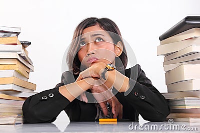 Clueless faced female student thinking hard in desperation Stock Photo