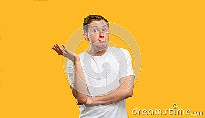 Clueless man portrait no idea doubtful guy shrug Stock Photo