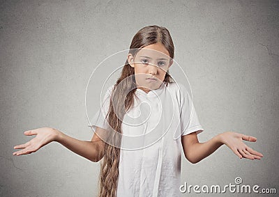 Clueless teenager girl shrugs shoulders Stock Photo