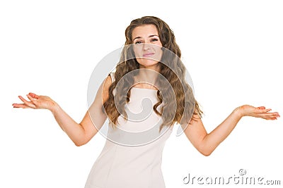 Clueless young woman shrugging shoulders Stock Photo