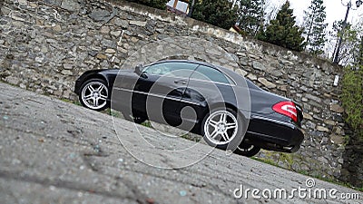 Cluj Napoca/Romania-April 7, 2017: Mercedes Benz W209 Coupe - year 2005, Elegance equipment, 19 inch wheels, profile view Editorial Stock Photo
