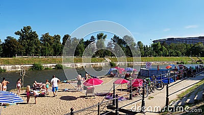Families with children sunbathing at the river banks Editorial Stock Photo