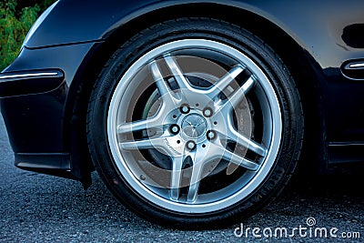 Nice sport elegant german car rim - big tires, ventilated brakes, chrome ornaments, Editorial Stock Photo