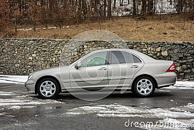 Cluj-Napoca,Romania - March 01,2018:Isolated Mercedes-Benz E class-alias W203,gold metallic colour,chrome ornaments blue tinted Editorial Stock Photo