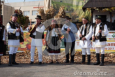 Band performing Romanian folk music in traditional costumes Editorial Stock Photo