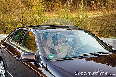 German luxurious sedan car - xxl sunroof, red/brown leather interior, chromed ornaments, expensive custom made individual car Editorial Stock Photo