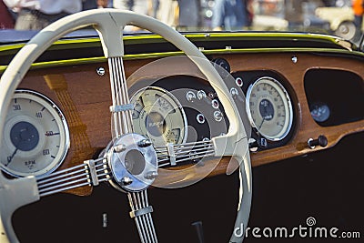 Cluj-Napoca, Romania - 24 September 2016 Klausenburg Retro Racing - Morgan Classic Retro Car steering wheel and wooden board Editorial Stock Photo