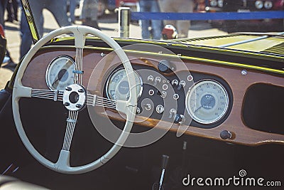 Cluj-Napoca, Romania - 24 September 2016 Klausenburg Retro Racing - Morgan Classic Retro Car steering wheel and wooden board Editorial Stock Photo