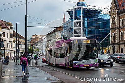 CLUJ-NAPOKA, ROMANIA - April 27, 2022. Trolleybus Solaris Trollino 18 #339 riding with passengers in the streets of Cluj-Napoka. Editorial Stock Photo