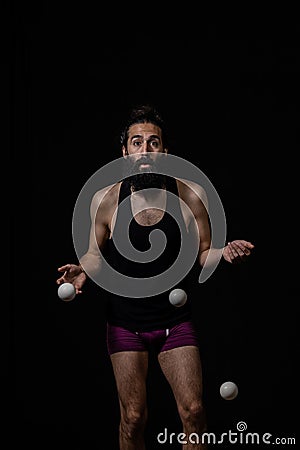 Clumsy juggler at the circus Stock Photo