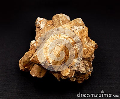 Cluster of feldspar mineral crystals isolated dark background. Geology mineralogy magazines websites articles, collection catalogs Editorial Stock Photo