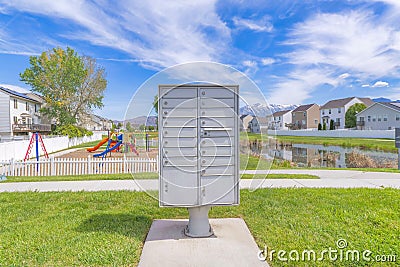 Cluster pedestal maibox near the playground and lake in a residential area at Utah valley Stock Photo