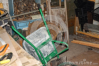 A cluttered farmhouse outbuilding or utility room in a rural household Stock Photo