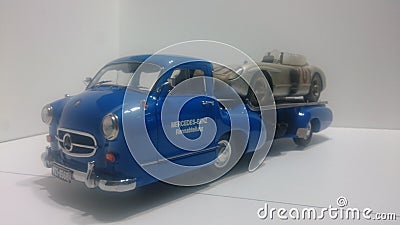 Cmc 1/18 model car - Mercedes Benz transporter Blue wonder and 300 SLR racing car Editorial Stock Photo